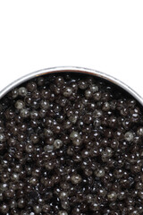 Black sturgeon caviar. Sturgeon caviar isolated on a white background in a jar. Top view, with copy space.