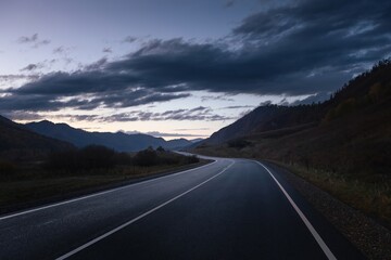 Naklejka premium highland road in the twilight.