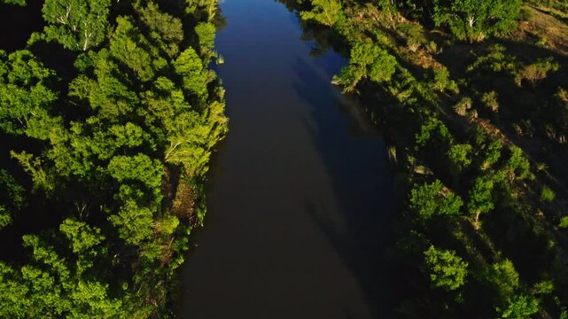 straight down aerial flyover of the green-lined Verde River near Camp Verde, Arizona