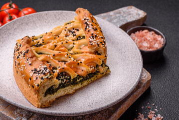 Pieces of quiche with salmon, spinach or broccoli, salt and spices