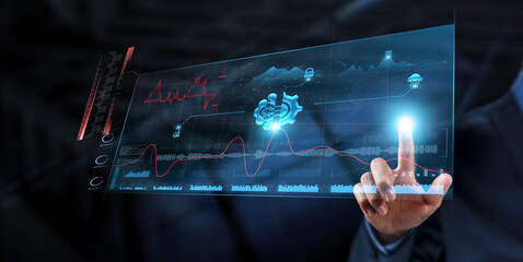 Machine Learning: Businessman analyzes data strategy with graph on digital screen. Predictive...
