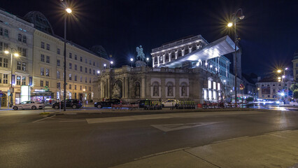 Night view of equestrian statue of Archduke Albert in front of the Albertina Museum timelapse hyperlapse in Vienna, Austria