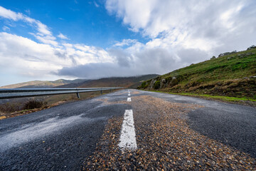 Mountain road that runs high in the mountains on the peaks of Somosierra, Madrid.