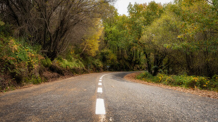 Panoramic view of mountain road with weather-damaged asphalt in Riaza, Segovia.