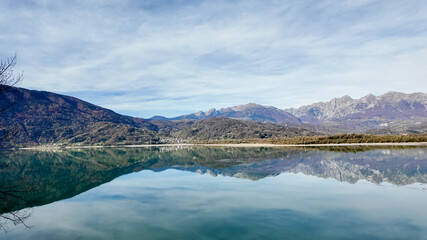 Tranquil mountain lake reflecting clear blue skies, ideal for relaxation and connected to nature during Earth Day celebrations Dolomite Alps, Dolomites