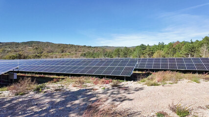 Fototapeta premium A vast solar panel farm under a clear blue sky, highlighting renewable energy solutions and environmental sustainability Dolomite Alps, Dolomites