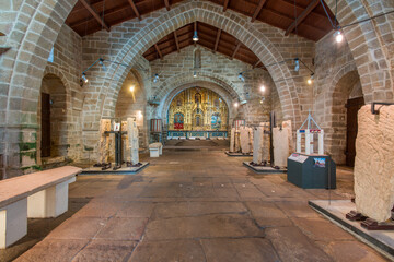 Fototapeta premium Interior of Church of Santa Maria a Nova with medieval tombstones, Noia