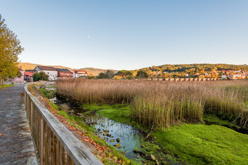 Ponte Nafonso at low tide during sunset with moon in the background