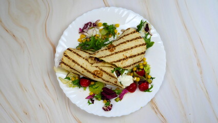 Tortilla wrap with vegetables and garlic sauce