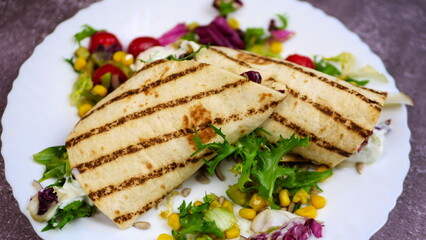 Tortilla wrap with vegetables and garlic sauce