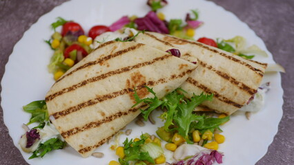 Tortilla wrap with vegetables and garlic sauce