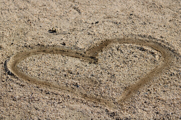 heart shape drawn in sand