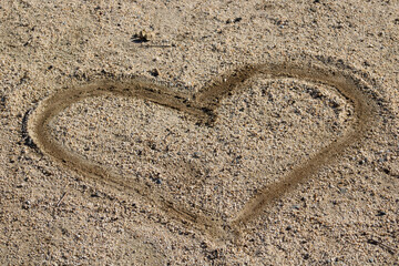 heart shape drawn in sand