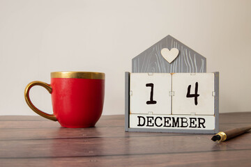 December 14th. Day 14 of month, calendar on wooden background. Winter time.