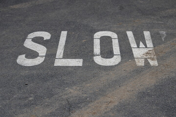 concrete road with slow directions on it