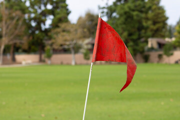 bright orange red soccer field flag