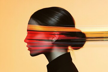 A side view of a woman with sleek hair tied back