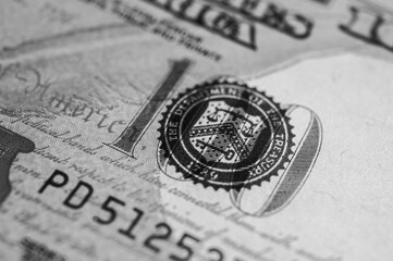 Black and white photo, close-up view, banner, of a 100 US dollar bill with intricate details, security features and vibrant colors. For finance, banking and wealth themes