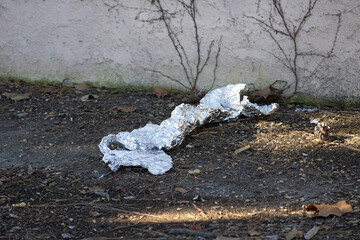 crumpled piece of silver tinfoil