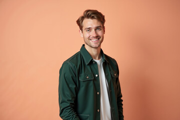 Fototapeta premium young man with a light skin tone, short brown hair, and a friendly smile. The image has a casual, approachable feel.