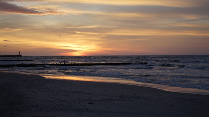 Fototapeta premium Sunset on the beach by the sea