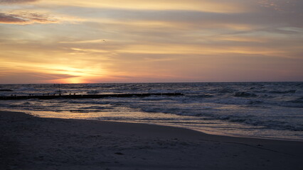Fototapeta premium Sunset on the beach by the sea
