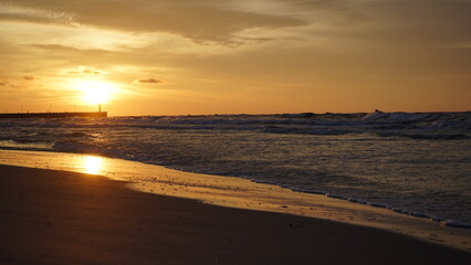 Fototapeta premium Sunset on the beach by the sea
