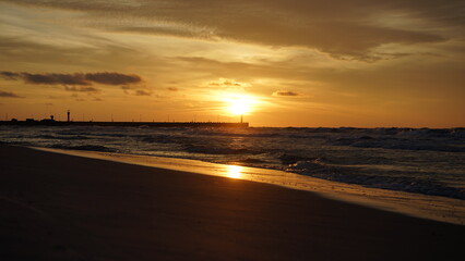 Sunset on the beach by the sea
