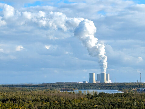 Landscape of rising smoke from the Lippendorf Power Station's cooling towers, located near Leipzig. Germany