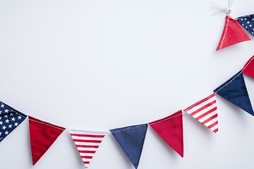 Obraz premium Red white and blue triangle american flag bunting arranged in semicircle.