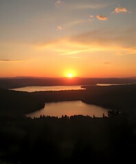 Golden Sunset Over Tranquil Lake with Reflective Skies
