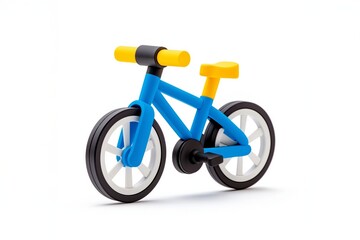 Fototapeta premium Bright blue and yellow toy bicycle with plastic wheels, isolated on a white background. Children's toy and play concept