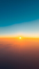 Obraz premium Clear sky at sunrise. Natural gradient of orange and blue colors. Golden sunlight. Abstract pattern, background, wallpaper. Graphic resources, design, copy space. Symbol of hope, heaven, peace, grap