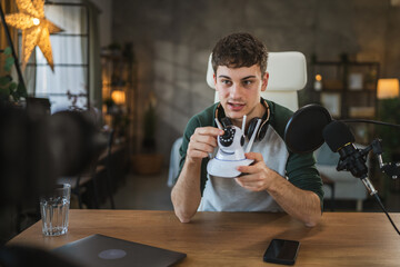 man technology blogger record video blog or v-log of home cctv camera