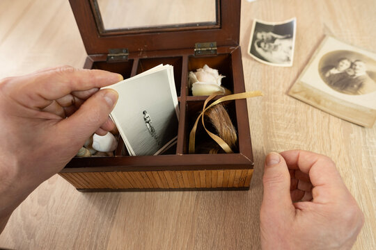 dear to heart memorabilia in old wooden box, seashells from past travels, vintage little gifts from loved ones, home archive