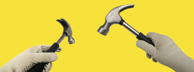 Set manual technical instruments hammers in craftsman's hand, tools quality craftsmanship and technical work on yellow background