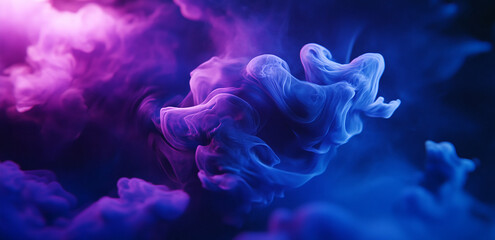 Obraz premium Blue and purple ink swirls and mixes in a dark background, creating a mesmerizing abstract pattern