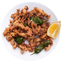 Plate is filled with fried squid carcasses, whole cooked shellfish seafood and baked green pepper. Isolated over white background