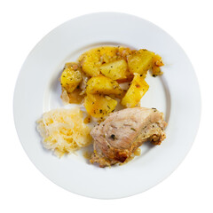 Delicious fried pork with pickled cabbage and potatoes served on platter. Isolated over white background