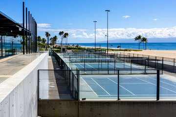 beach paddle tennis tournament setup with multiple courts 