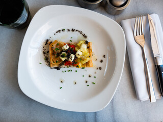 National Spanish coca de escalibada with goat cheese and black olives