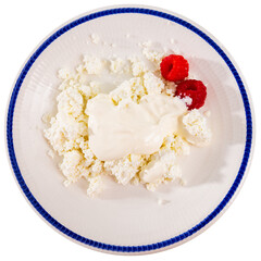 Cottage cheese mato with fresh raspberry and sour cream on a ceramic plate. Isolated over white background