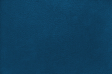 Natural, genuine solid blue leather texture close up, macro. Structure of matte leatherette, artifical skin surface with embossing pattern. Background, wallpaper, backdrop