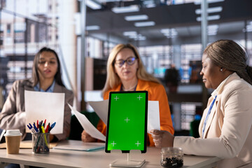 Team of goal oriented general managers discuss about goals next to copy space, using their analytics and global information to work on expansion. Working hard to obtain more funds for objectives.