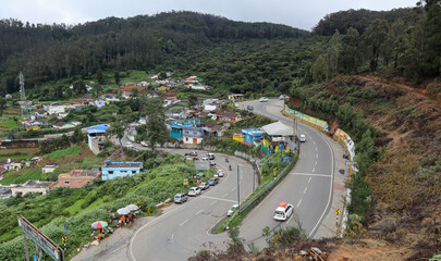 A Dramatic high angle view of the Ooty cityscape known for its Bewitching landscapes and scenery, is a popular travel destination in Tamil Nadu, India.