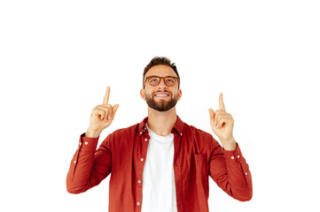 Handsome stylish caucasian or arabian man dressed in a red shirt and with glasses, standing on...
