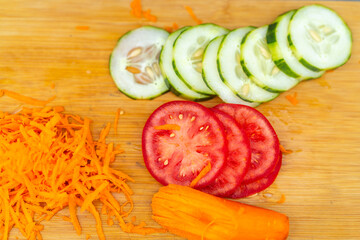 Chef preparing ingredients for fresh summer salad on cutting board