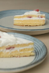 Japanese strawberry shortcake on each stylish large and small plate on a wooden table