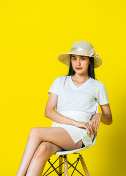 Western Woman in White V-Neck and Skirt Sitting for Creative Fashion Mockup