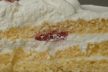 Japanese strawberry shortcake on a stylish large plate on a wooden table